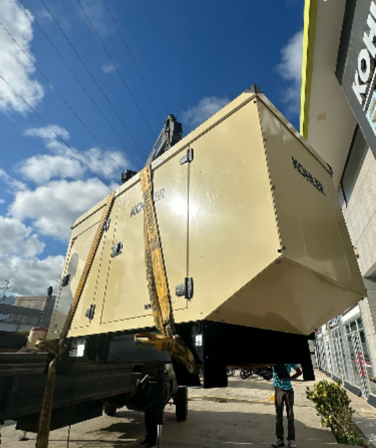 Generator being lifted onto truck